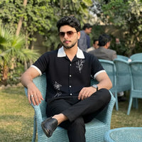 Black Short-Sleeve Knit Cuban Collar Shirt with White Contrast Trim and Line-Art Floral Embroidery view 2