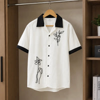 Black Short-Sleeve Knit Cuban Collar Shirt with White Contrast Trim and Line-Art Floral Embroidery view 5